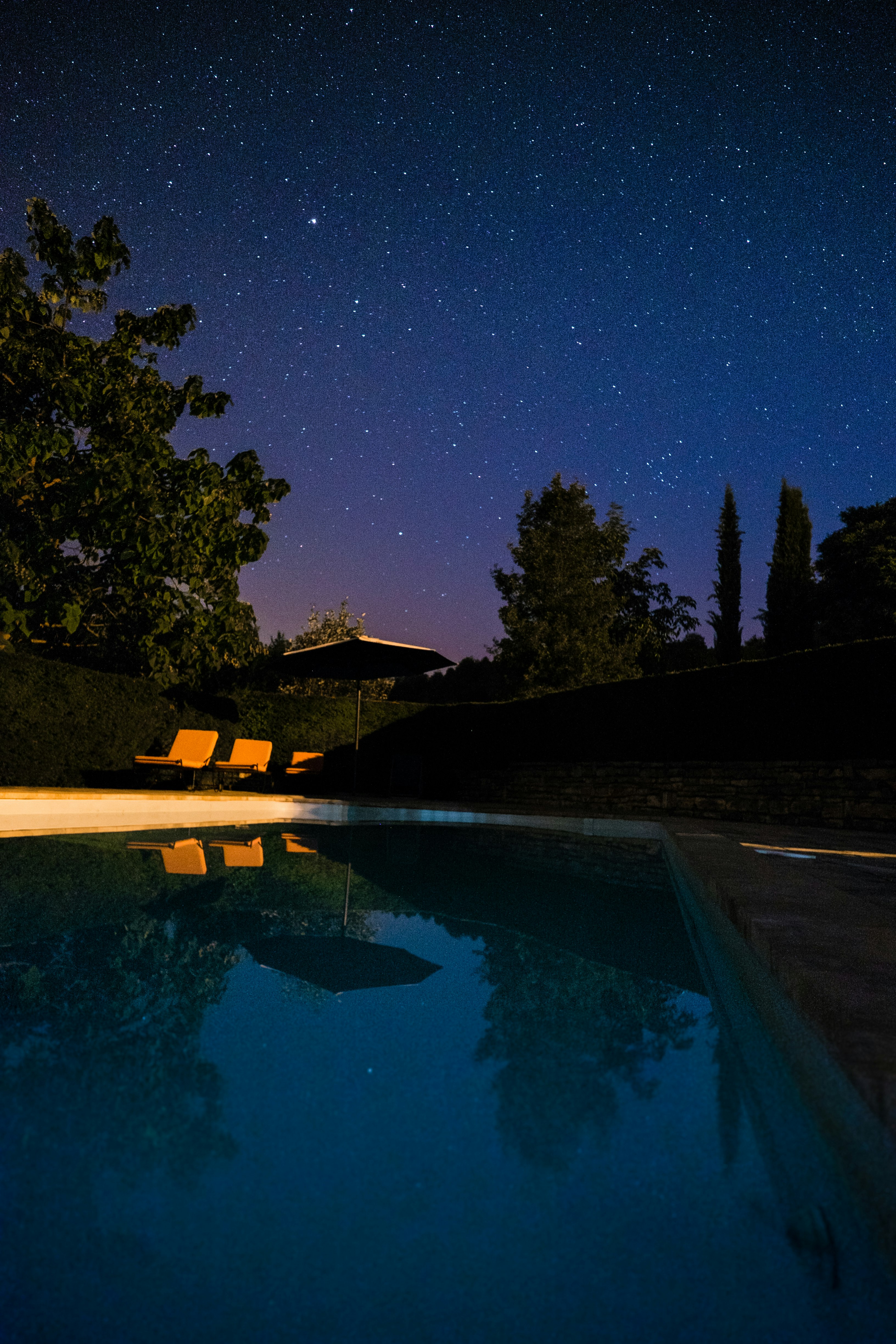 white and brown backyard pool during night time